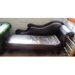 A Victorian chaise longue with mahogany showframe (slightly a/f) upholstered in brown leather
