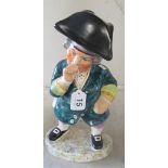 A Staffordshire style figure Snuff Taker with tricorn hat as lid