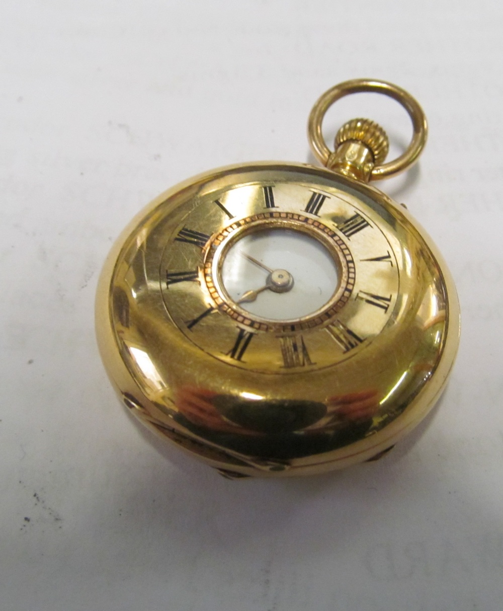 A small 18k gold half hunter pocket watch (inner cover metal), slight dent between 3 & 4