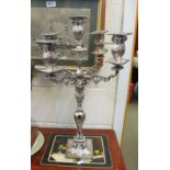 A large plated candelabra and other plated items