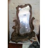 A gilt freestanding mirror