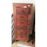 A tall modern six drawer chest