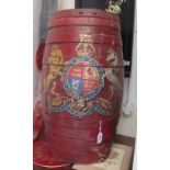 A red painted barrel with coat of arms