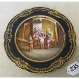 A 19th Century Sevres plate handpainted 17th Century interior scene of two men smoking and