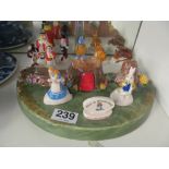 An Alice in Wonderland set with stand