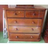 A Victorian mahogany chest of two short and three long drawers and turned handles