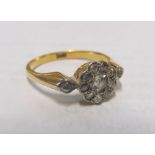 An 18ct gold diamond cluster ring (one stone missing) 3.3gms, size P