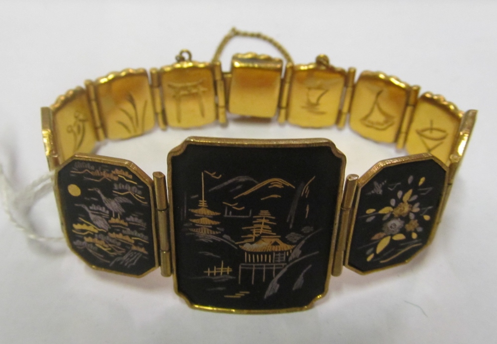 A gilt bracelet with silver and gold inlaid Japanese scenes, Mexican bracelet and Mexican pendant on