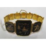 A gilt bracelet with silver and gold inlaid Japanese scenes, Mexican bracelet and Mexican pendant on