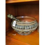 A Doulton Lambeth salad bowl and servers with stylized floral pattern and plated rim