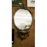 A gilt mirror and freestanding mirror