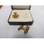 A pair Fleur de Lys cufflinks