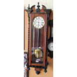 A mahogany wall clock