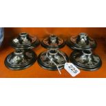 A set of eight black Bakelite and inlaid silver coloured candleholders