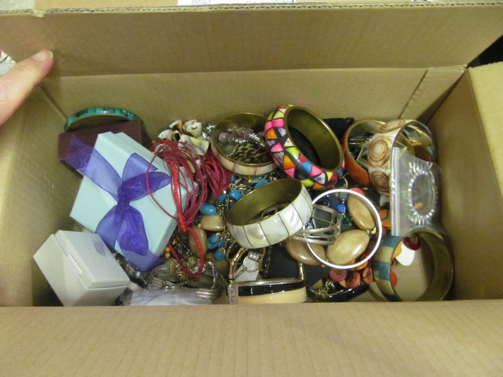 A box of costume bangles and earrings