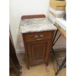 An Edwardian mahogany bedside cabinet with marble top