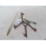 A Jordan & Cook Ltd. Worthing letter opener and a bunch of five vintage keys