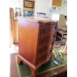 A small yew chest of drawers