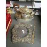 A plated teapot, silver cup, silver handled paperknife/penknife and a silver photo frame