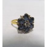 An 18ct gold blue cluster ring 5.9gms, size M/N