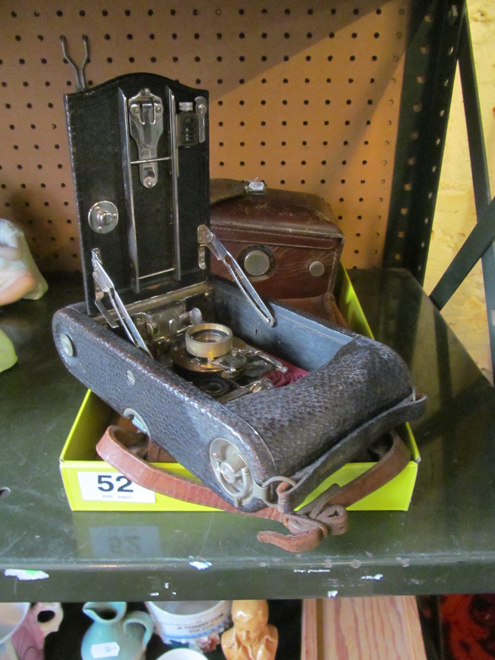 An Eastman Kodak Co. folding camera and a Franke & Heidecke box camera