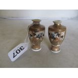 A pair of miniature Satsuma vases decorated geisha