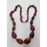 A strand of graduated amber beads and 2 amber necklaces