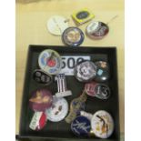 A James Corty pendant Queen with gas mask 'Hear no Evil' and various badges including a Noel
