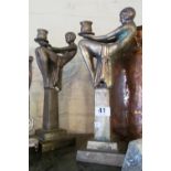A pair metal Art Deco style candlesticks seated ladies on columns