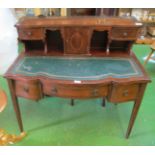 An Edwardian serpentine fronted desk