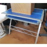 A metal folding desk with blue glass insert