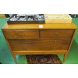 A pair retro chests one of two short and two long drawers and the other three long drawers