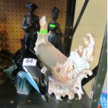 A pair of black bisque figures 18th Century man and lady, Poole Pottery dolphin and an Edwardian