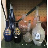 Three blue glass decanters, blue decanter with silver coloured stopper, wine flagon, vinaigrette and