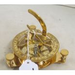 A modern brass compass
