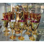A Venetian part red and gilt set decanter six champagnes and five wines