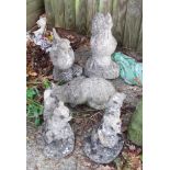 Two concrete chickens, cat and two squirrels