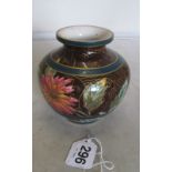 A Doulton faience vase pink/orange flowers on brown ground