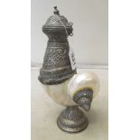 A Tibetan nautilus shell decanter with embossed white metal mounts
