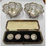 A pair of silver Mappin & Webb pierced bon bon dishes and a set of four silver buttons lady