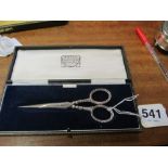 A pair of silver handled scissors (i.c)