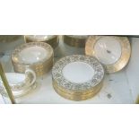 A Wedgwood gold Damask pattern dinner set fourteen place setting; large dinner plates, dessert