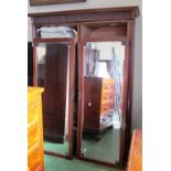 A mahogany double wardrobe with mirror doors Powell & Powell