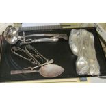 A plated ladle, joint holder, plated cutlery and five pairs tongs