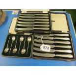 A set of twelve silver handled Art Deco knives and a set of bean terminal coffee spoons