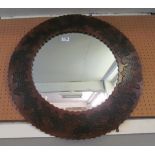 A circular leather mirror from Brazil