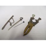 A miniature sword in sheath as brooch and a dagger cigar/cheroot cutter