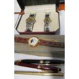 A cased gent's and ladies watches, another watch, pen and two biros