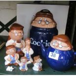 A Tetley Tea cookie jar, teapot, pepper and salt, moneybox and two figures