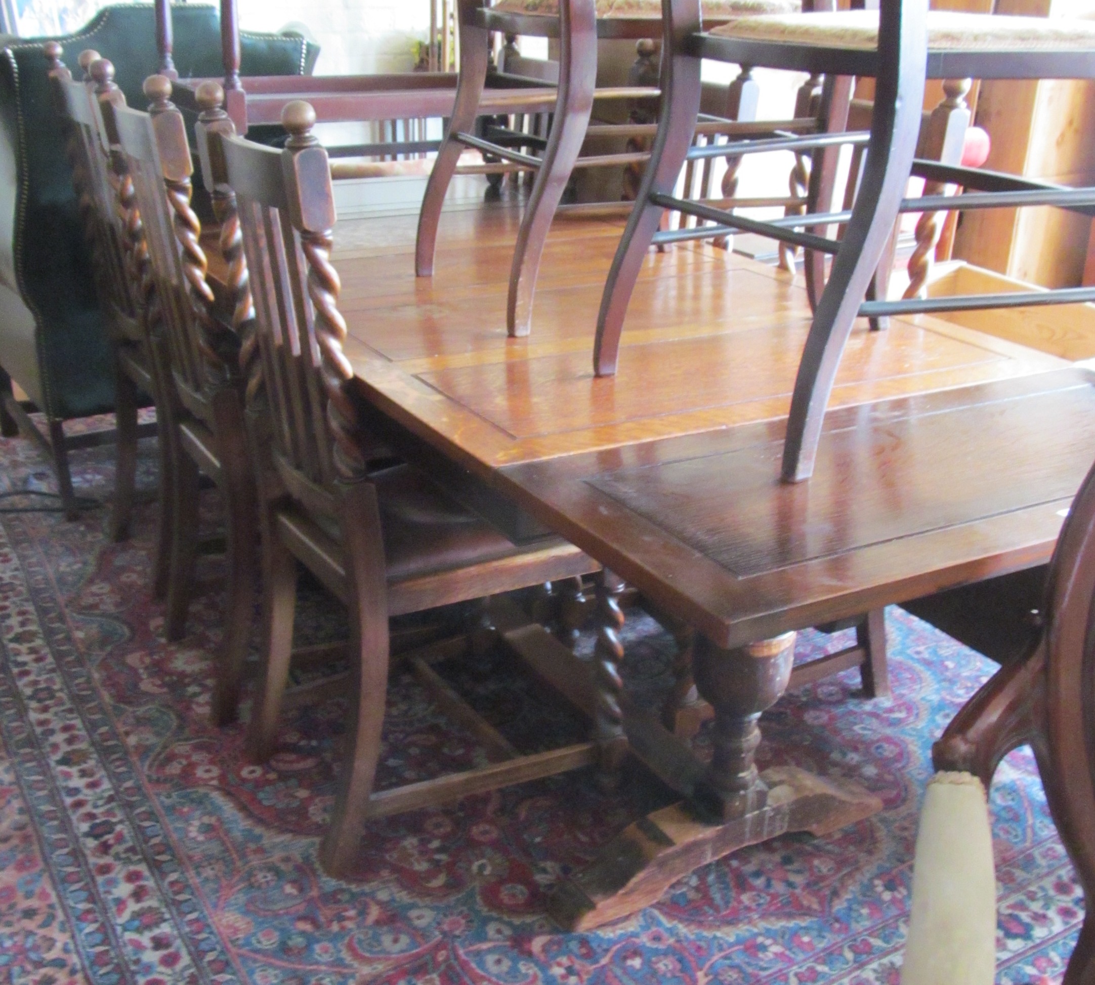 An oak drawleaf table and set of 6 chairs